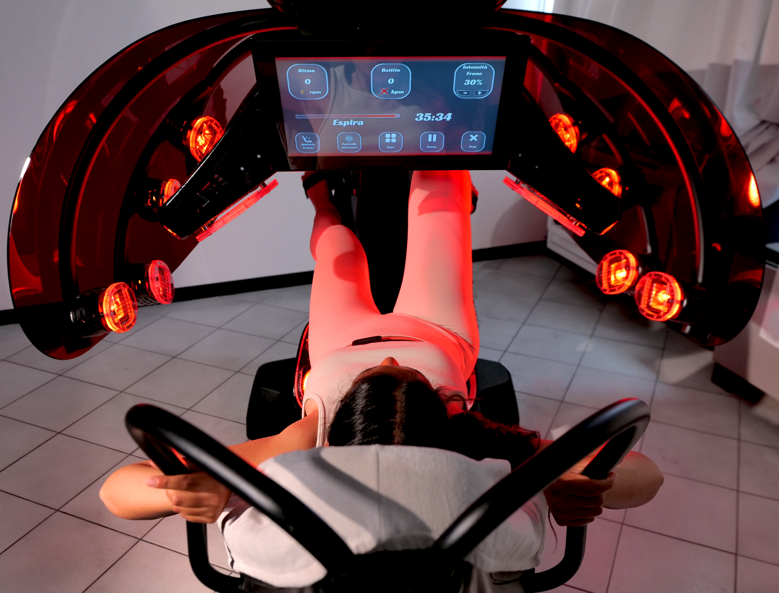 Bird's eye view of Woman pedaling on InfraBaldan.